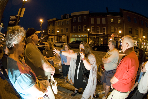 Baltimore Ghost Tours guide Leanna leads a group in Fells Point